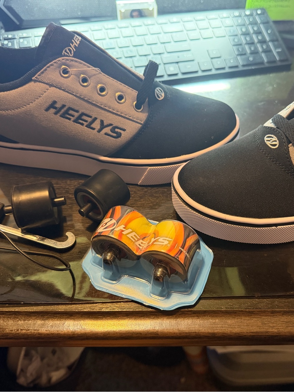Heelys Black and White Low-Top Skate Shoes with Yellow Warning Sticker